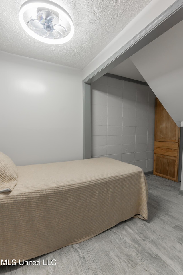 95 Nesting Site, Vicksburg, MS 39183 - bedroom featuring a textured ceiling and wood finished floors