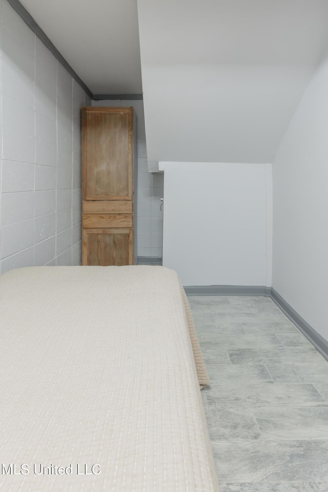 95 Nesting Site, Vicksburg, MS 39183 - unfurnished bedroom featuring tile walls, wood finished floors, and baseboards