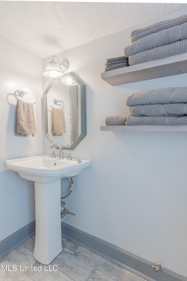 95 Nesting Site, Vicksburg, MS 39183 - bathroom featuring baseboards and a textured ceiling