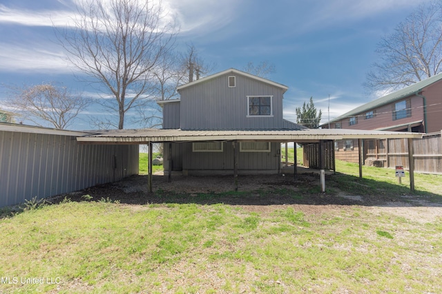 95 Nesting Site, Vicksburg, MS 39183 - back of house with a carport, a yard, and metal roof