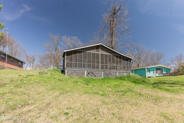 95 Nesting Site, Vicksburg, MS 39183 - rear view of house featuring a yard and a sunroom