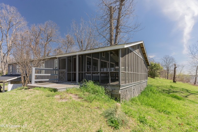 95 Nesting Site, Vicksburg, MS 39183 - rear view of house with a lawn and a sunroom