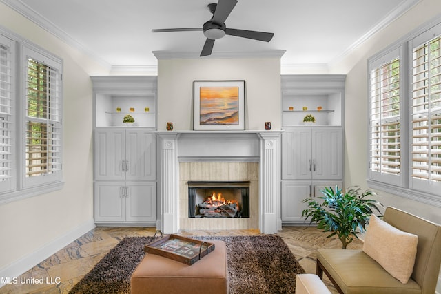 living room featuring ornamental molding, a wealth of natural light, and a fireplace