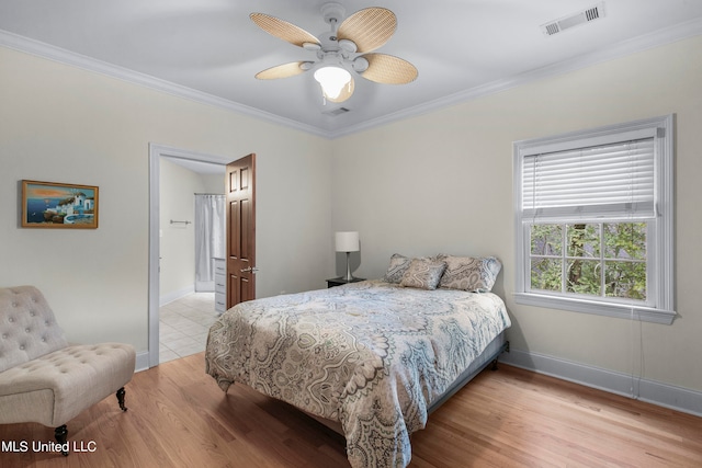 bedroom with ornamental molding, light hardwood / wood-style floors, and ceiling fan