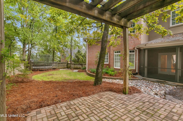 view of patio / terrace with a sunroom