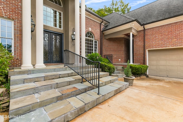 view of exterior entry featuring a garage