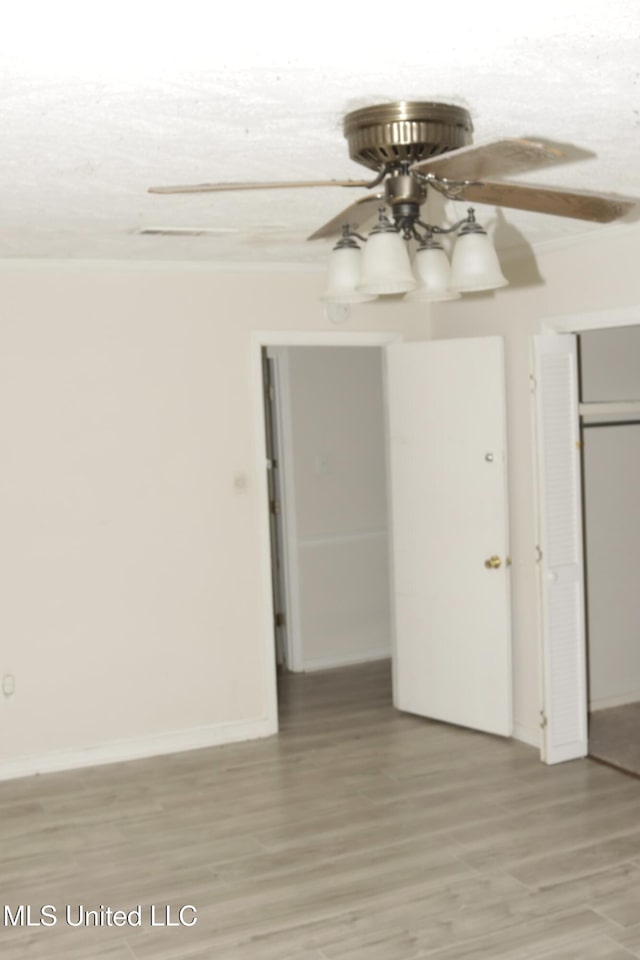 219 Lake Cove Dr, Jackson, MS 39212 - spare room with a ceiling fan, light wood finished floors, and crown molding