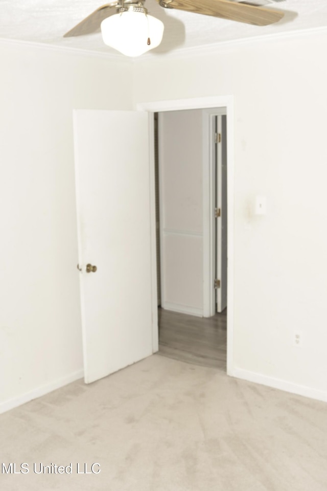 219 Lake Cove Dr, Jackson, MS 39212 - empty room with ornamental molding, ceiling fan, and light colored carpet