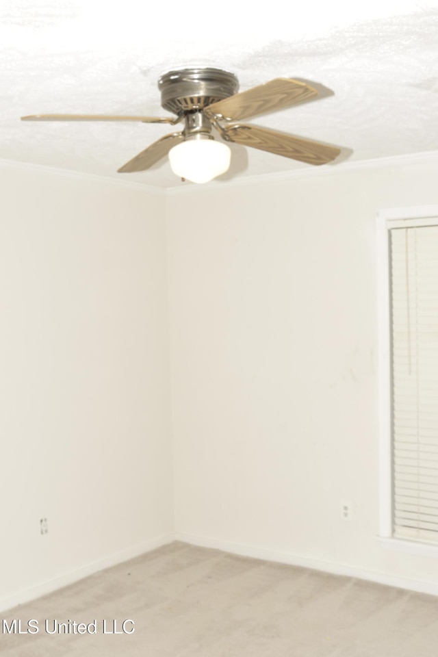 219 Lake Cove Dr, Jackson, MS 39212 - spare room featuring light carpet, crown molding, and ceiling fan