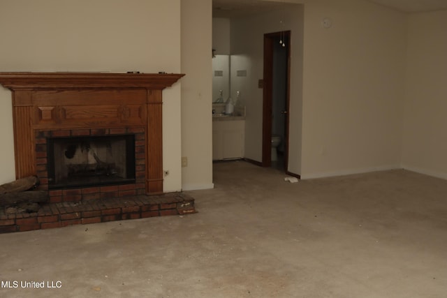 219 Lake Cove Dr, Jackson, MS 39212 - unfurnished living room with carpet flooring and a brick fireplace