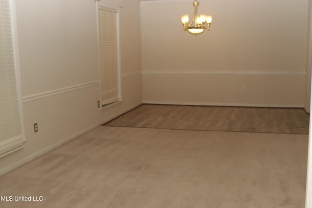 219 Lake Cove Dr, Jackson, MS 39212 - unfurnished dining area with a chandelier and carpet