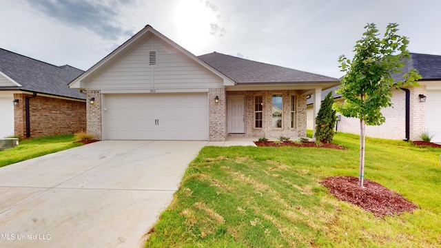 ranch-style house with a front yard and a garage