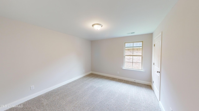 empty room with light colored carpet