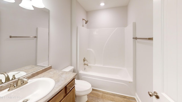 full bathroom featuring toilet, vanity, bathing tub / shower combination, and tile patterned floors