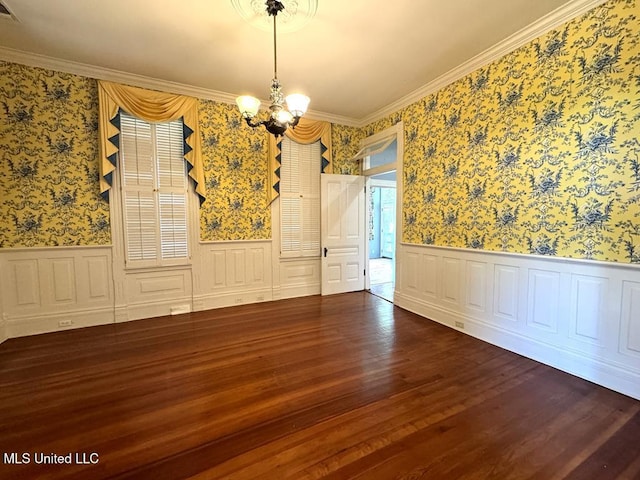 unfurnished dining area with hardwood / wood-style floors, an inviting chandelier, and crown molding