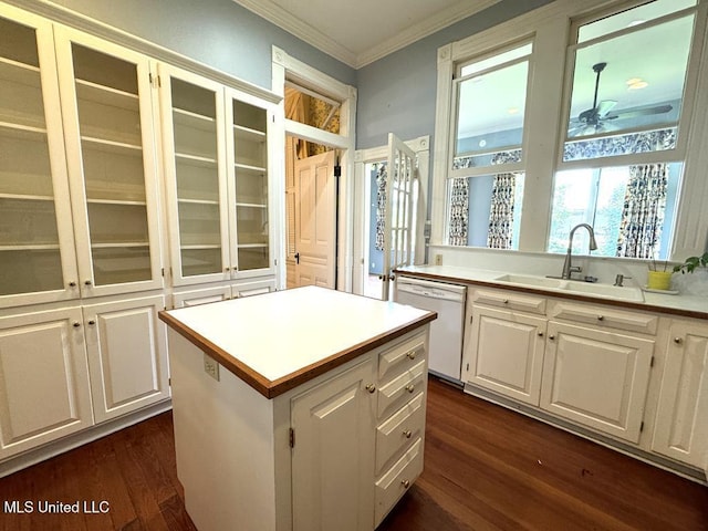 kitchen featuring white dishwasher, white cabinets, sink, ceiling fan, and a kitchen island