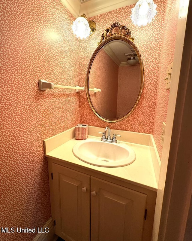 bathroom featuring vanity and crown molding