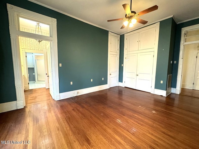 unfurnished bedroom with ceiling fan, hardwood / wood-style flooring, and ornamental molding