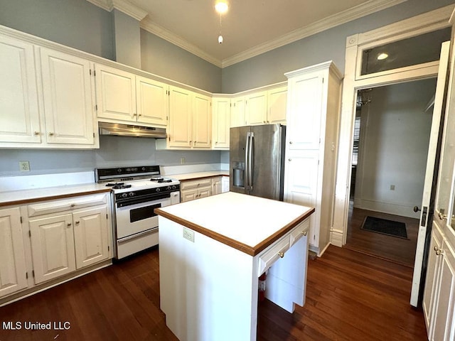 kitchen with stainless steel refrigerator with ice dispenser, white stove, a center island, and white cabinetry