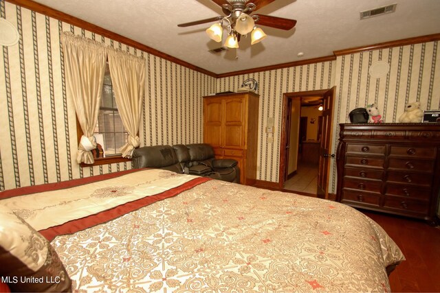 bedroom featuring ornamental molding, a textured ceiling, and ceiling fan