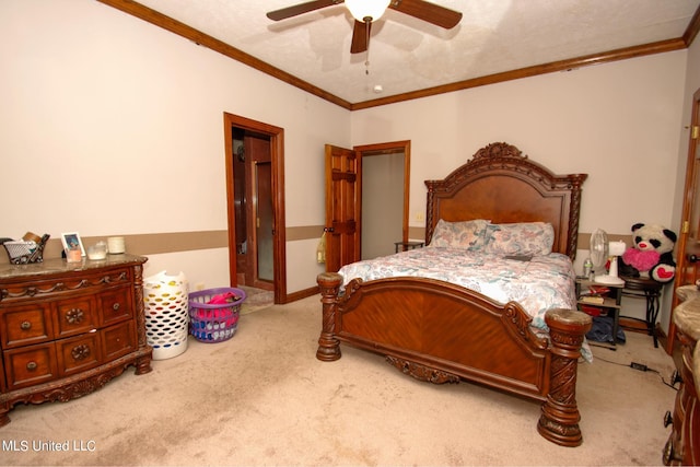 bedroom featuring ceiling fan, crown molding, a textured ceiling, and carpet floors