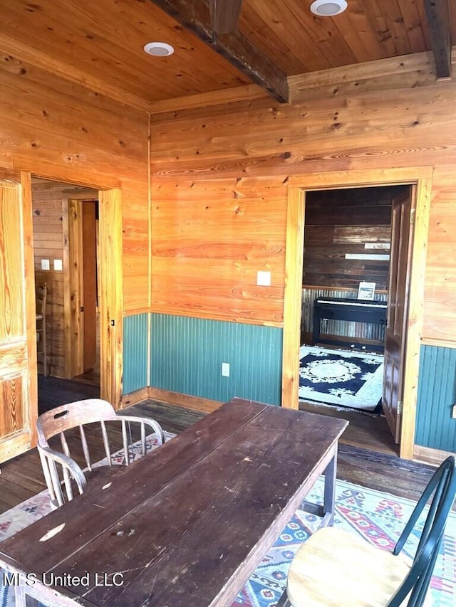 12 N Oak St, Vidalia, LA 71373 - dining space featuring beam ceiling and wood walls