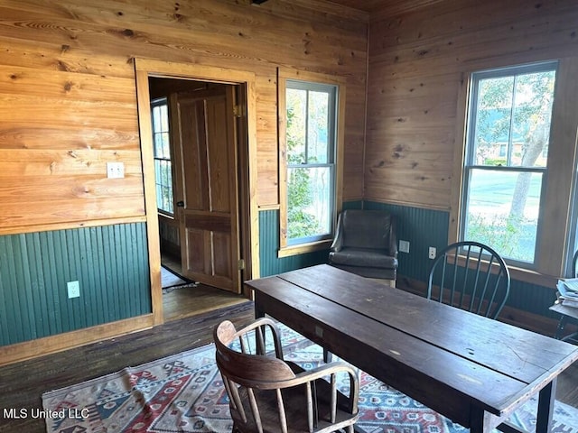 12 N Oak St, Vidalia, LA 71373 - sitting room with a wealth of natural light, dark wood-type flooring, and wood walls