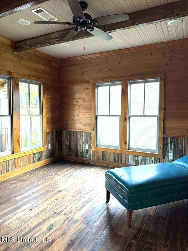 12 N Oak St, Vidalia, LA 71373 - interior space with ceiling fan, a wealth of natural light, wood-type flooring, and wooden walls