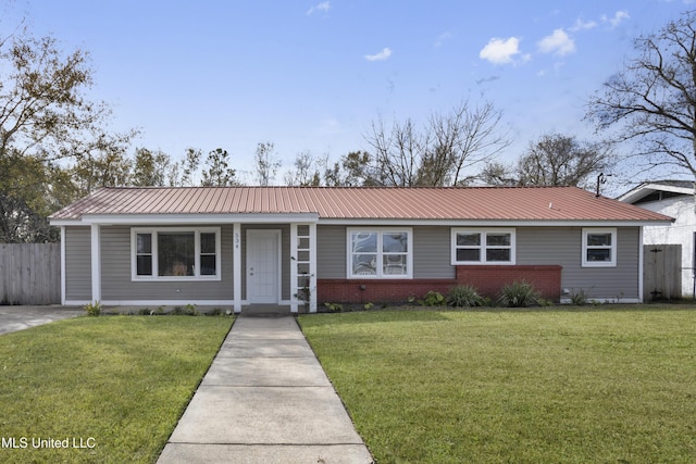 ranch-style home featuring a front yard