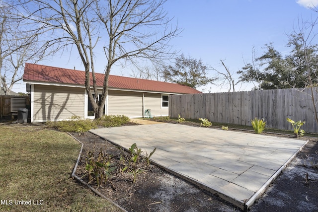 exterior space featuring a patio area and a lawn