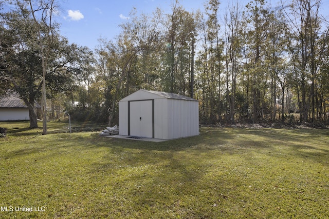 view of outdoor structure with a yard