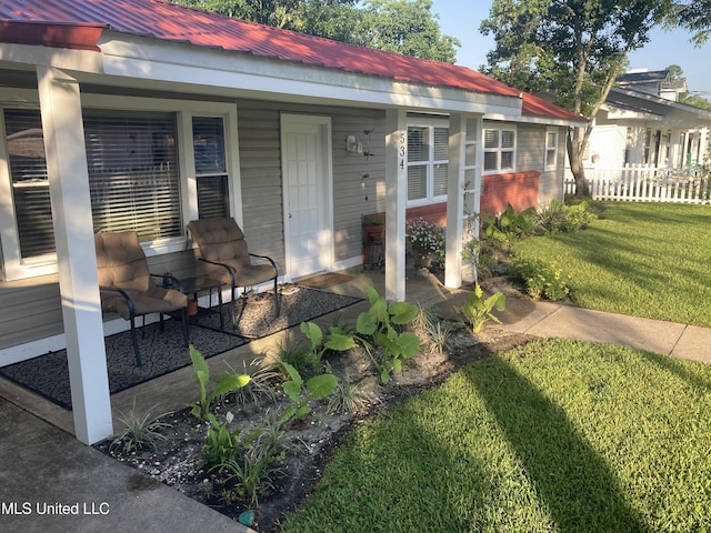 view of front of home featuring a porch and a front yard