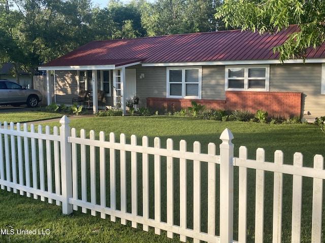 ranch-style house with a front lawn