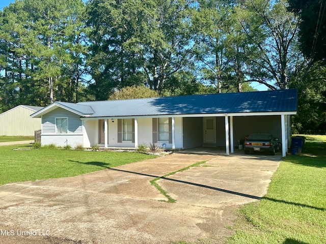 ranch-style house featuring a carport and a front yard