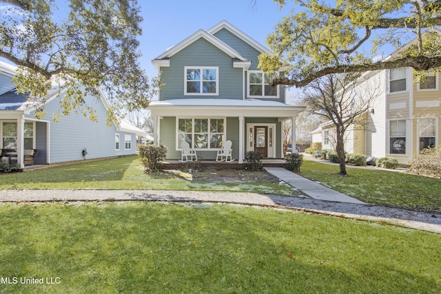 view of front facade featuring a front yard and covered porch