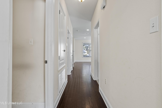 hallway with dark wood-type flooring