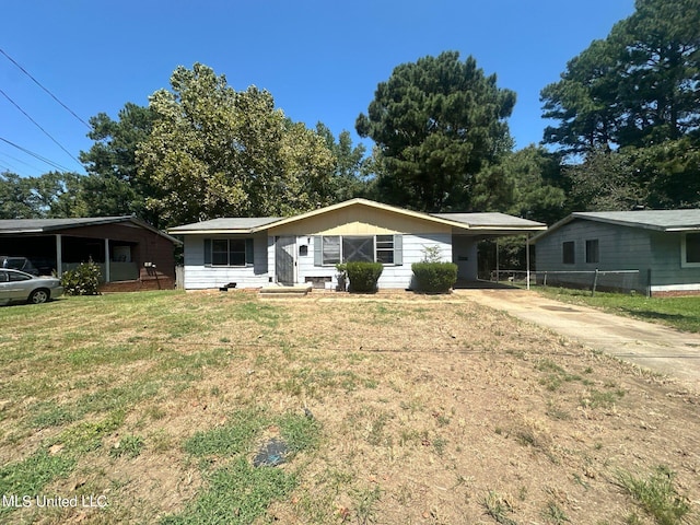 single story home featuring a carport and a front yard