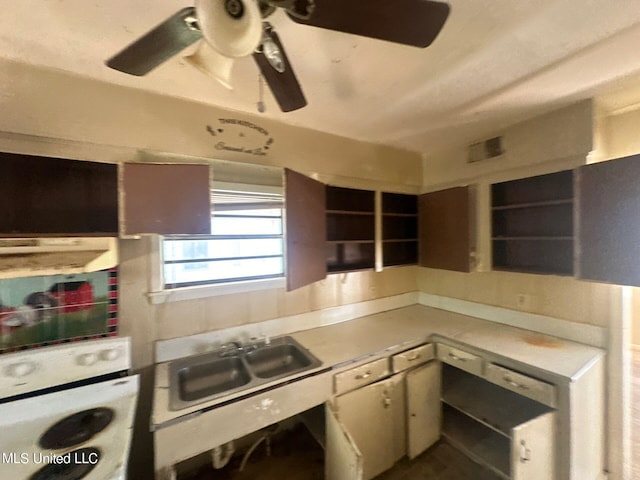 kitchen with washer / dryer, sink, and white oven