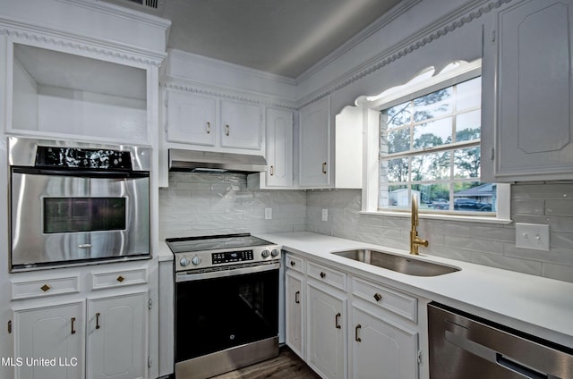 394 Woodcliff Dr, Jackson, MS 39212 - kitchen with light countertops, white cabinets, under cabinet range hood, stainless steel appliances, and a sink