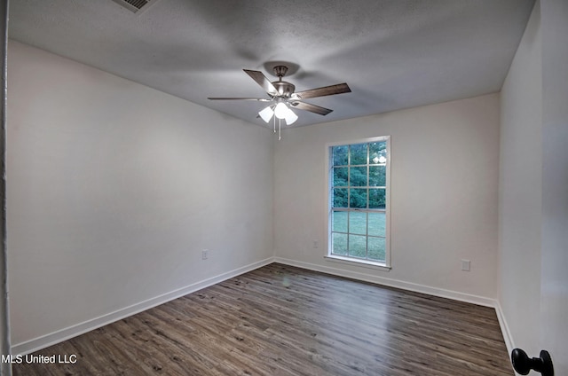 394 Woodcliff Dr, Jackson, MS 39212 - unfurnished room featuring dark wood-style flooring, baseboards, a ceiling fan, and a textured ceiling