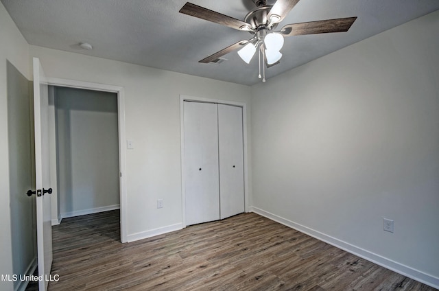394 Woodcliff Dr, Jackson, MS 39212 - unfurnished bedroom with a ceiling fan, wood finished floors, baseboards, and a closet