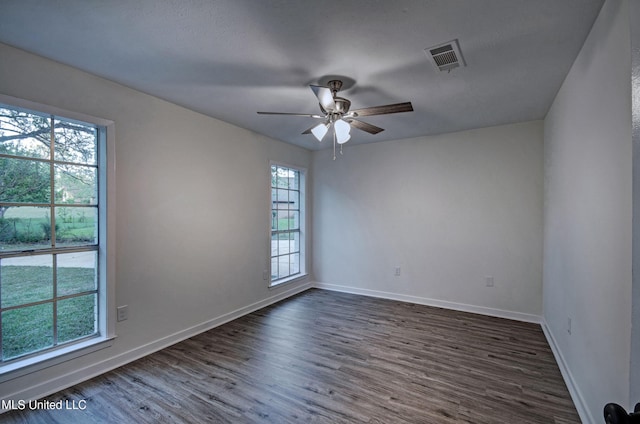 394 Woodcliff Dr, Jackson, MS 39212 - empty room with ceiling fan, baseboards, dark wood-style floors, and visible vents