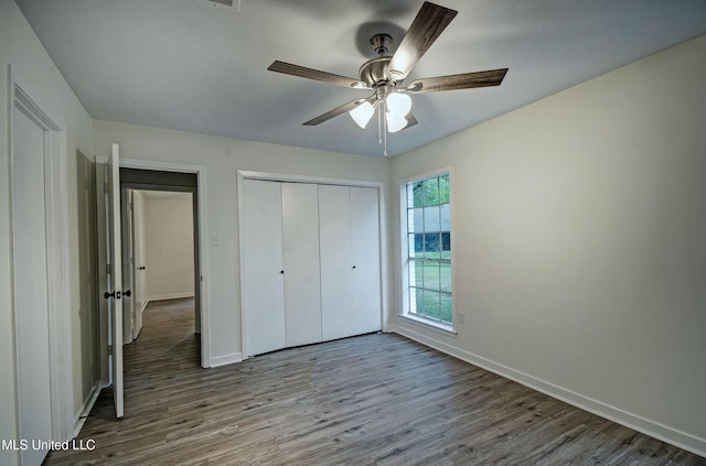 394 Woodcliff Dr, Jackson, MS 39212 - unfurnished bedroom featuring a closet, baseboards, ceiling fan, and wood finished floors