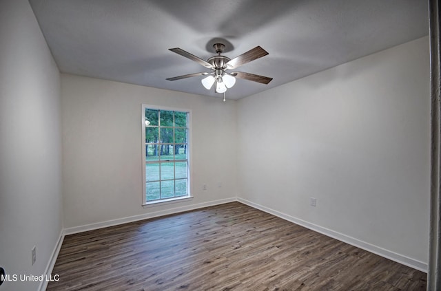 394 Woodcliff Dr, Jackson, MS 39212 - empty room with dark wood-style flooring, baseboards, and a ceiling fan