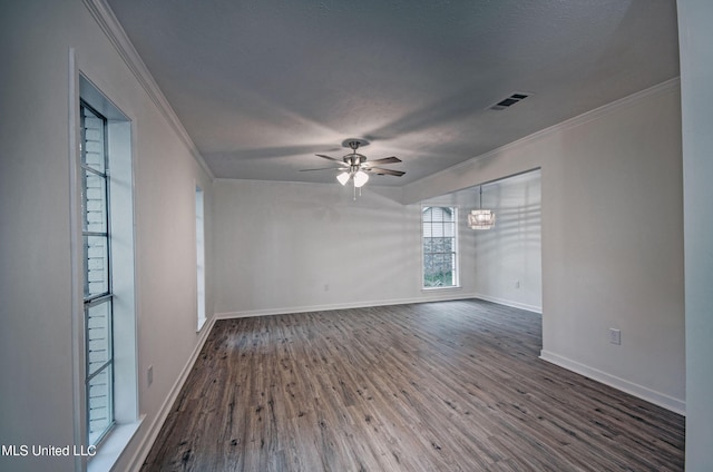 394 Woodcliff Dr, Jackson, MS 39212 - spare room with ceiling fan with notable chandelier, wood finished floors, ornamental molding, and visible vents