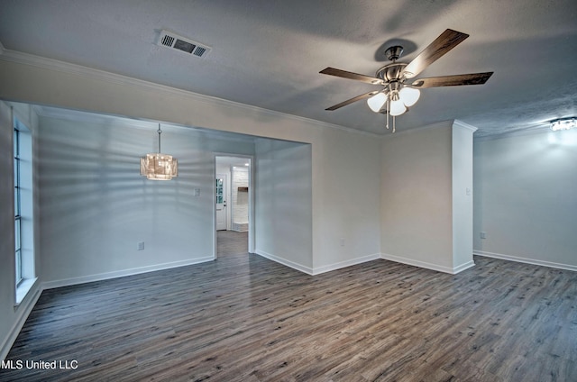 394 Woodcliff Dr, Jackson, MS 39212 - spare room featuring baseboards, dark wood-style floors, crown molding, visible vents, and ceiling fan with notable chandelier