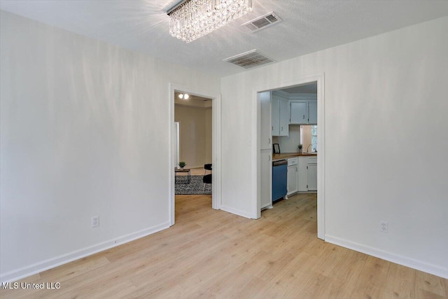 602 Hathaway Dr, Clinton, MS 39056 - spare room featuring light wood-type flooring and baseboards