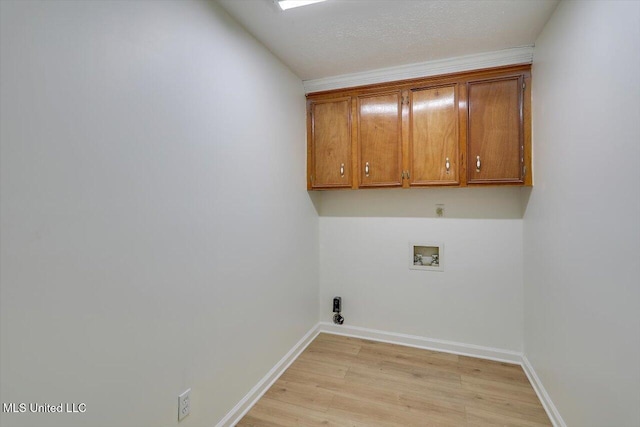 602 Hathaway Dr, Clinton, MS 39056 - laundry room featuring washer hookup, cabinet space, light wood finished floors, and hookup for an electric dryer