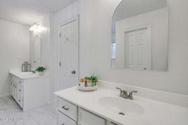 602 Hathaway Dr, Clinton, MS 39056 - bathroom featuring two vanities and marble finish floors