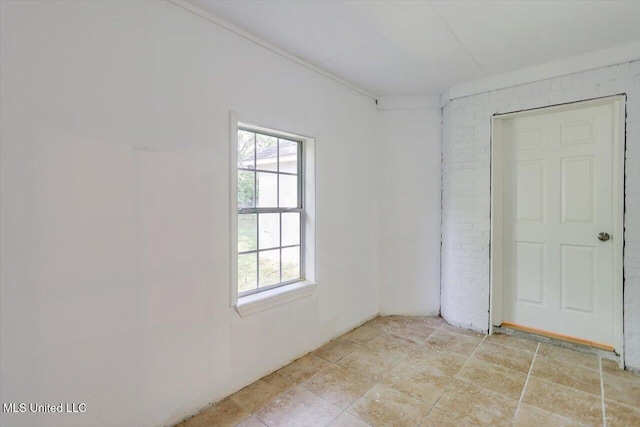 602 Hathaway Dr, Clinton, MS 39056 - unfurnished bedroom with brick wall
